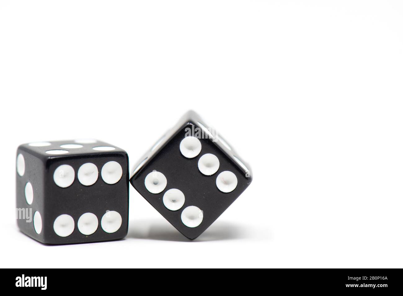 Pair of black dice isolated on white background Stock Photo Alamy