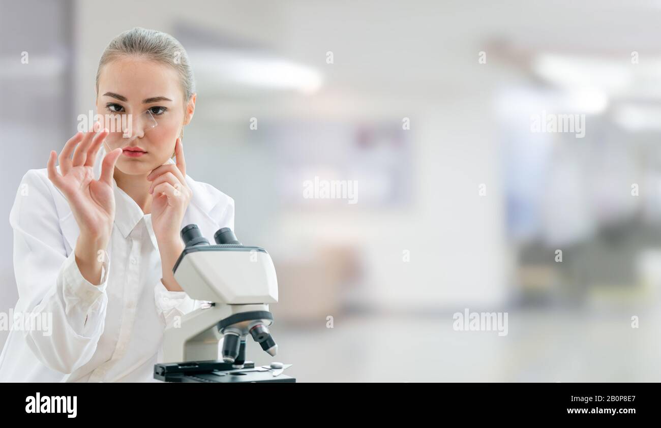 Scientist researcher using microscope in laboratory. Medical healthcare
