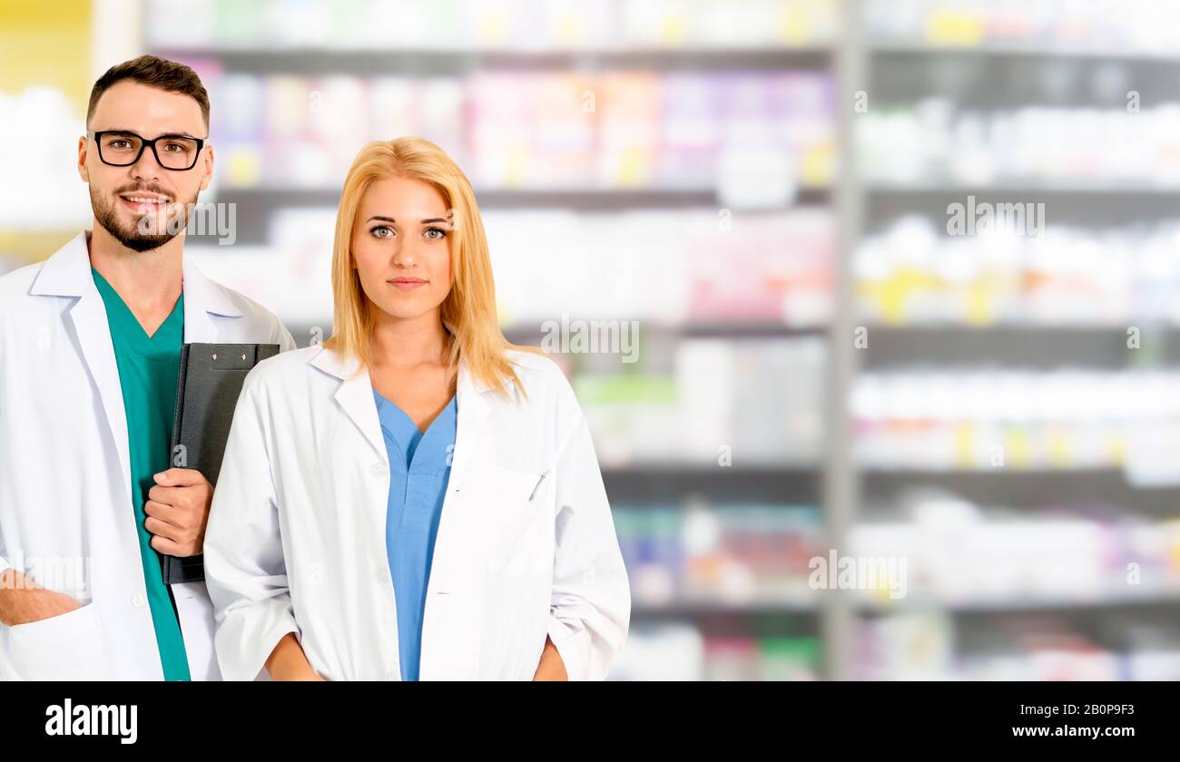 Pharmacist working with another pharmacist in the pharmacy. Healthcare