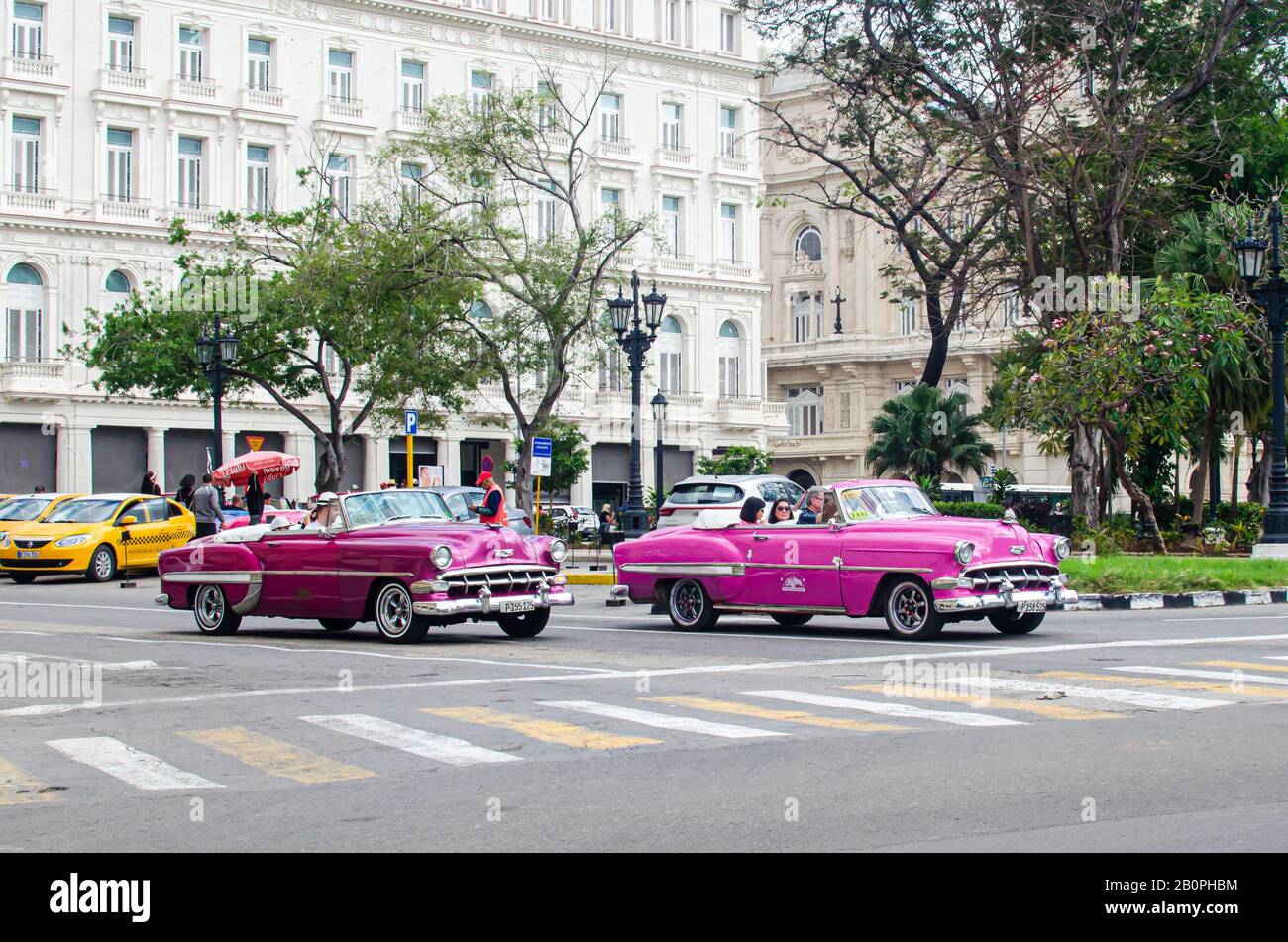 Scene at La Havana in Cuba.  The vintage cars runs along a city frozen in time Stock Photo