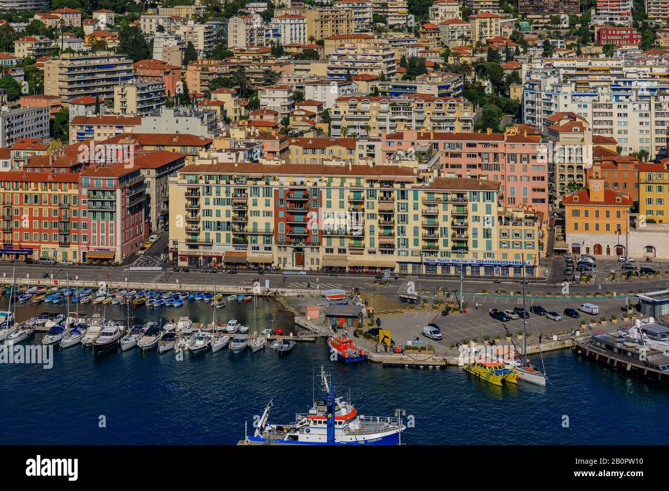 Nice, France - May 25, 2019: View of boats, coastline and traditional houses in Lympia port on the Mediterranean Sea, Cote d'Azur in Nice, France Stock Photo