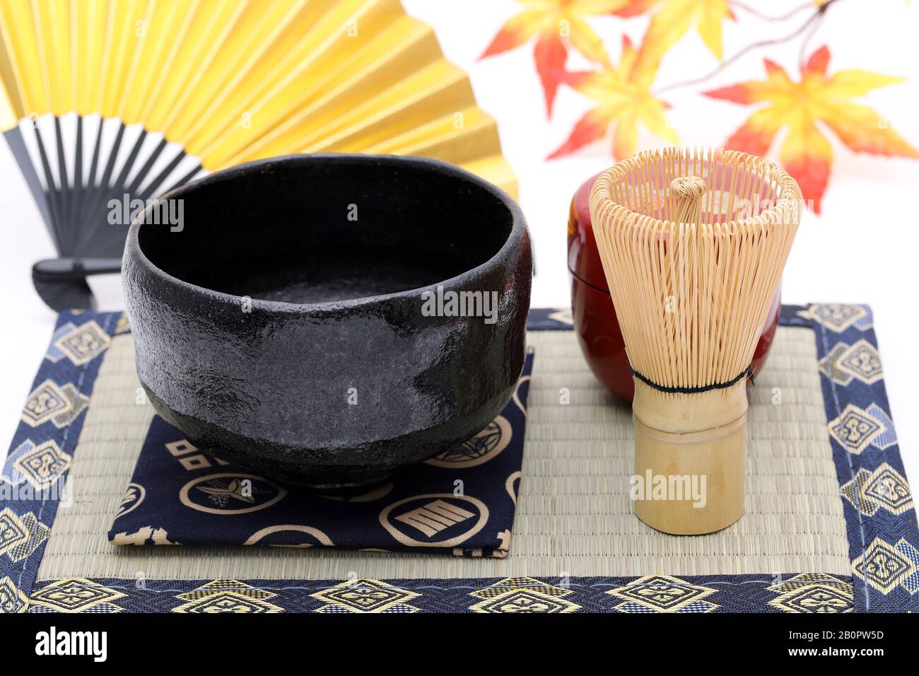 Tea bowl with tea whisk used in Japanese matcha green tea ceremony on white hackgrond Stock Photo