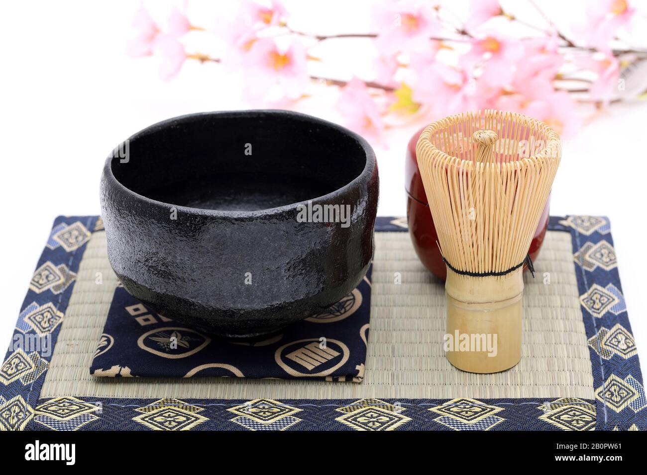 Tea bowl with tea whisk used in Japanese matcha green tea ceremony on white hackgrond Stock Photo