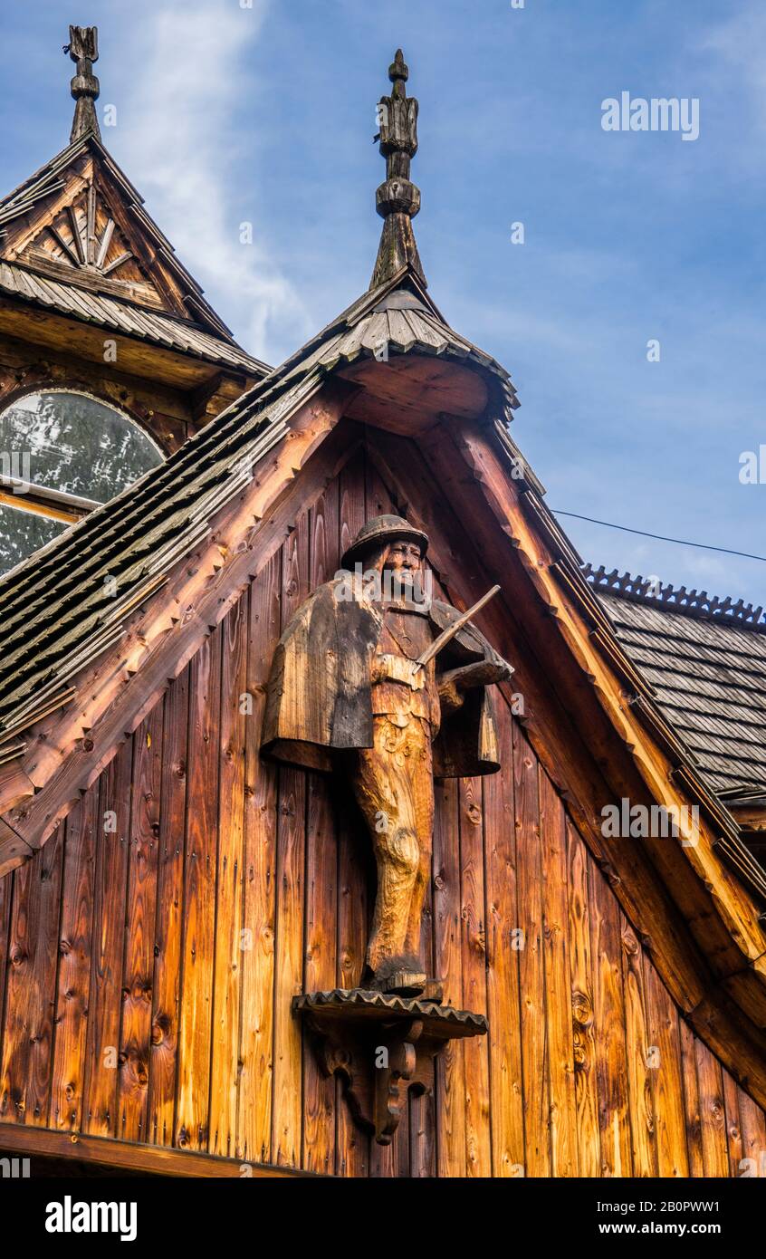 a wood carved fiddler statue adorns a gable of Villa Koliba, the first example of the Zakopane Style of architecture, inspired by the motifs and tradi Stock Photo