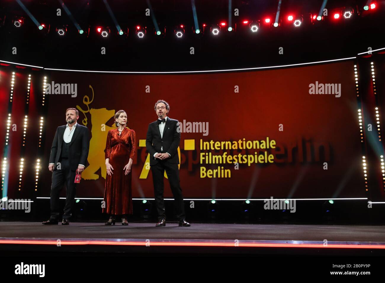 (200221) -- BERLIN, Feb. 21, 2020 (Xinhua) -- Berlinale Executive Director Mariette Rissenbeek (C) and Berlinale Artistic Director Carlo Chatrian (R) attend the opening ceremony of the 70th Berlin International Film Festival in Berlin, capital of Germany, Feb. 20, 2020. The 70th Berlin International Film Festival, or as it's more commonly known, the Berlinale, kicked off on Thursday with a literary drama 'My Salinger Year'.A total of 18 films have made it into this year's competition category and they will compete for the Golden Bear for best film, and other individual awards, the Silver Bears Stock Photo