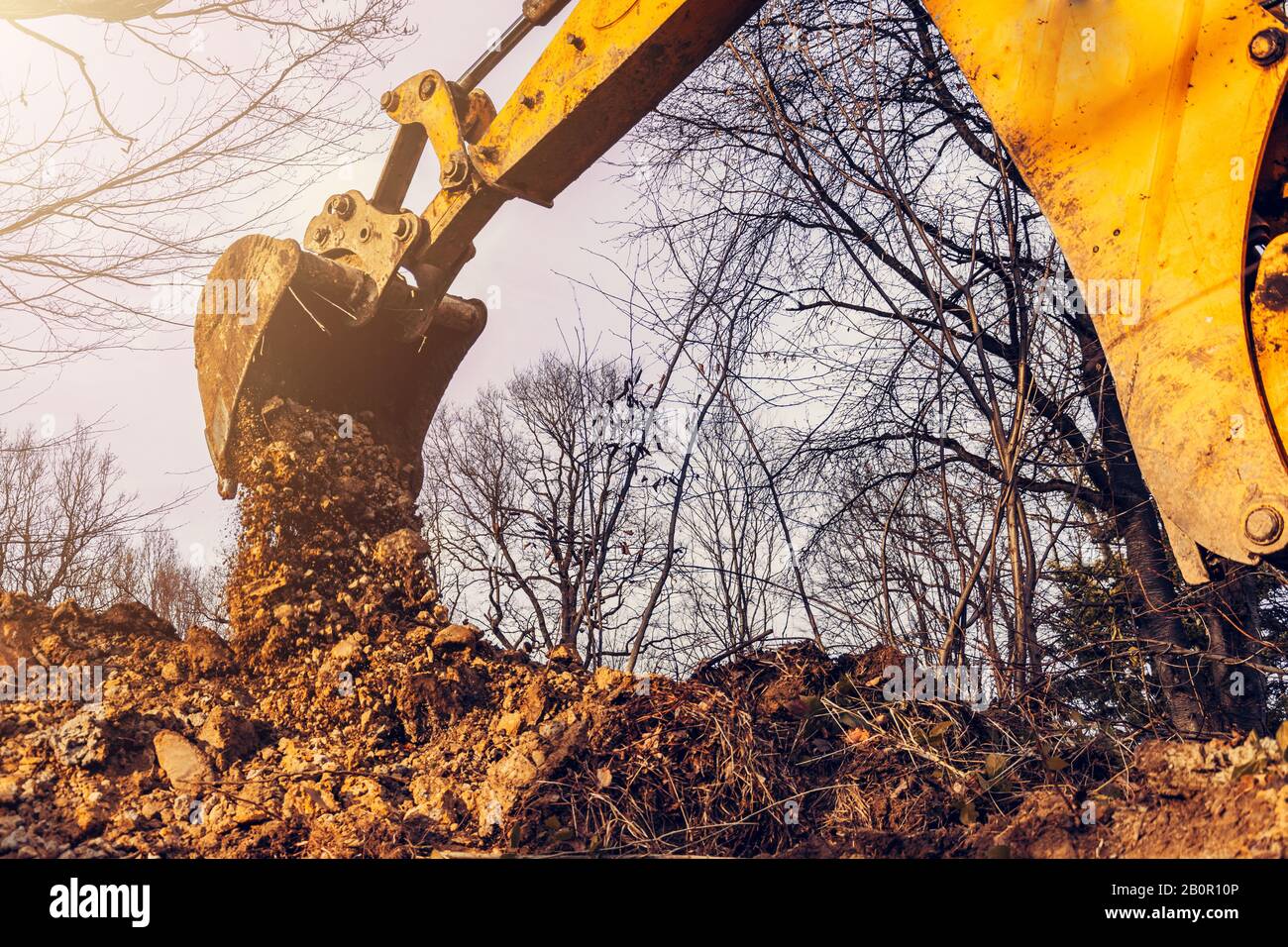 The excavator performs excavation work by digging the ground with a