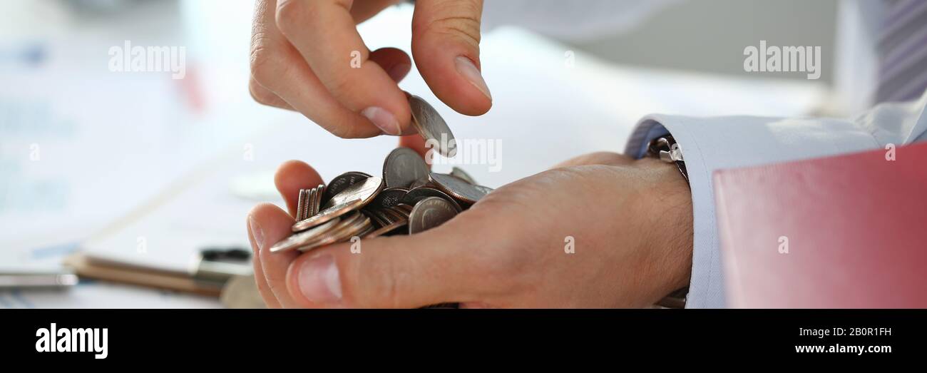Hand businessman putting pin money Stock Photo Alamy