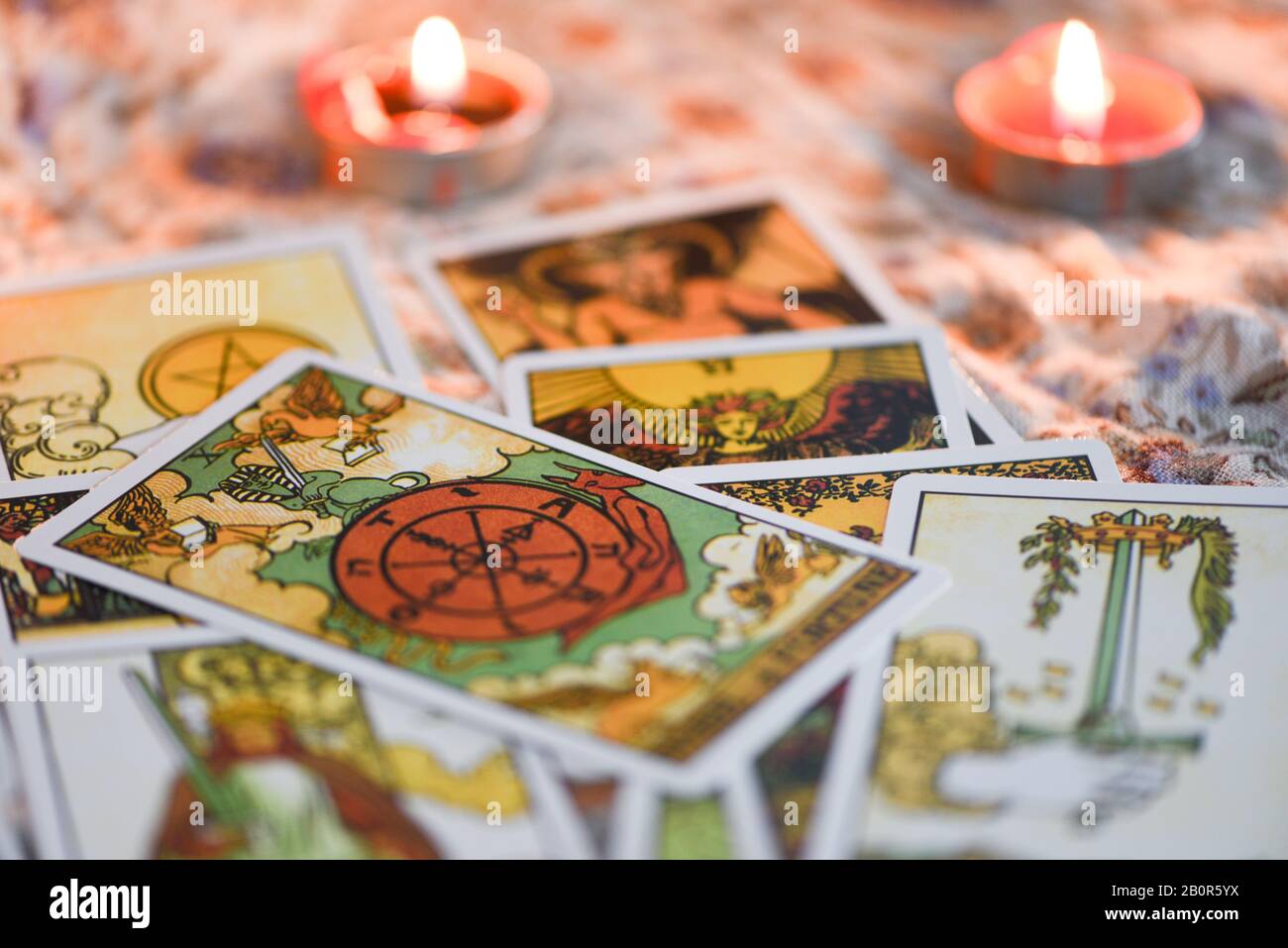 Tarot card with candlelight on the darkness background for Astrology