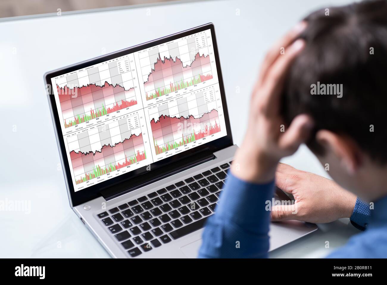 Despairing Businessman Faced With Stock Market Financial Losses Stock Photo