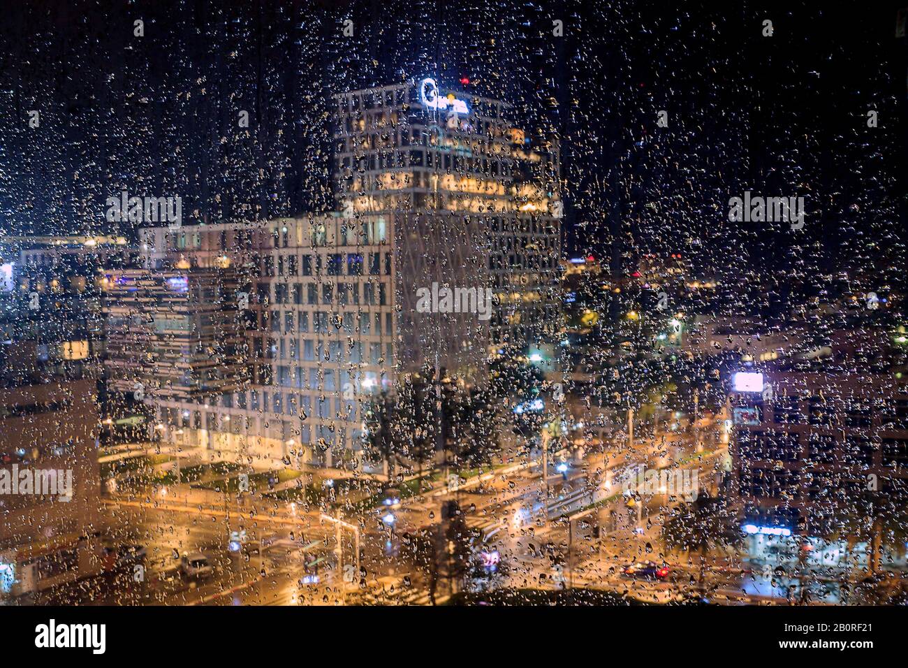 City through rainy window at night hi-res stock photography and images ...
