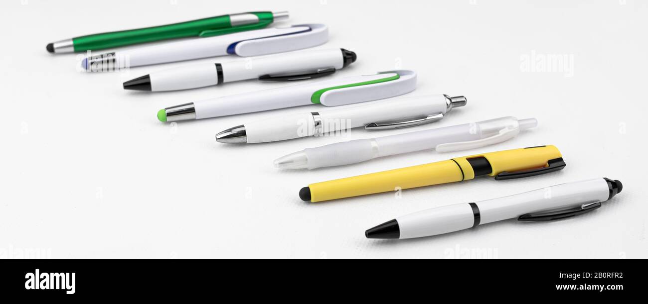 Set of pens of different styles and shapes on white background Stock Photo