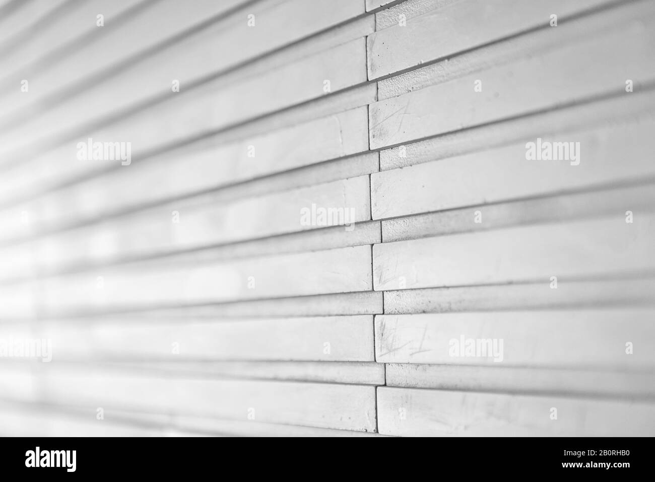 A close up of light gray wall tile with relief Stock Photo