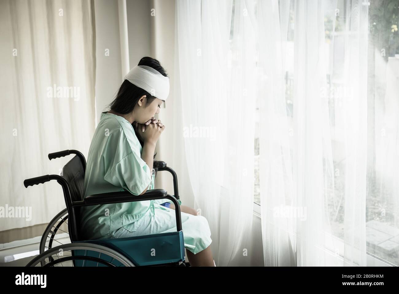 Female patients sitting on wheelchairs have pain after hospitalization