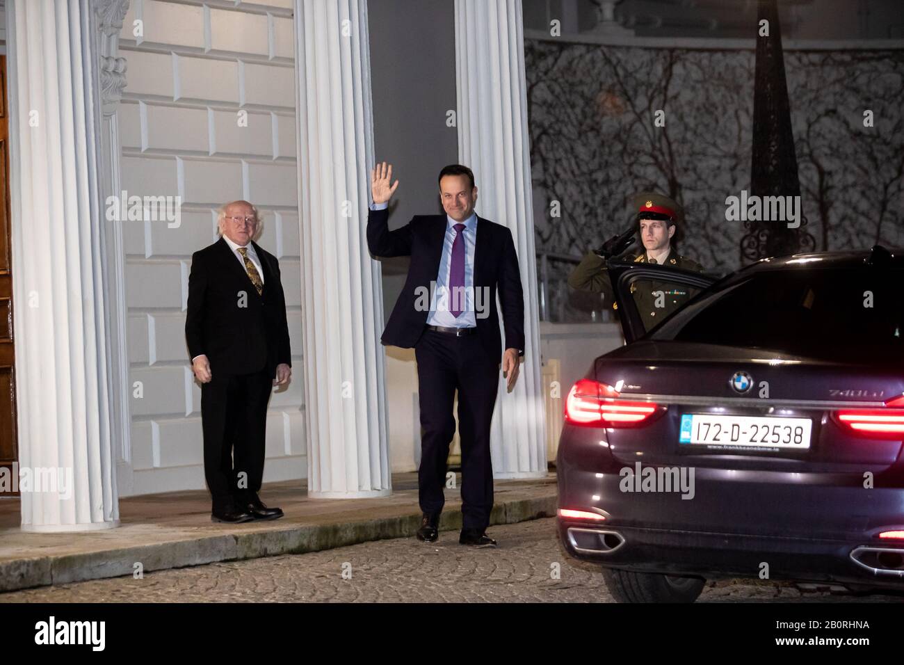 Dublin. 21st Feb, 2020. Irish Prime Minister Leo Varadkar (C) leaves the official residence of the Irish president after tendering his resignation to Irish President Michael D. Higgins (L) in Dublin, Ireland, Feb. 20, 2020. The newly formed lower house of the Irish parliament failed to elect a new prime minister for the country during its first sitting held here on Thursday, reported Irish national radio and television broadcaster RTE. Credit: Xinhua/Alamy Live News Stock Photo