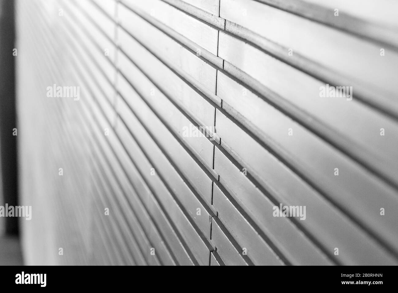 An upper view of gray relieved wall tile, a gray background Stock Photo