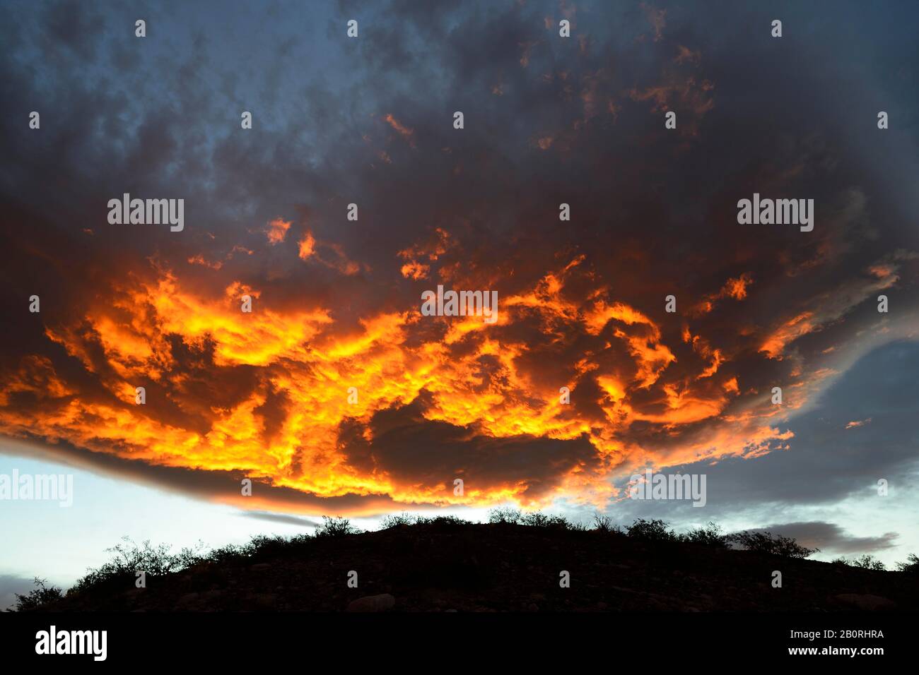 Burning clouds at sunset, near Chos Malal, Neuquen province, Patagonia, Argentina Stock Photo