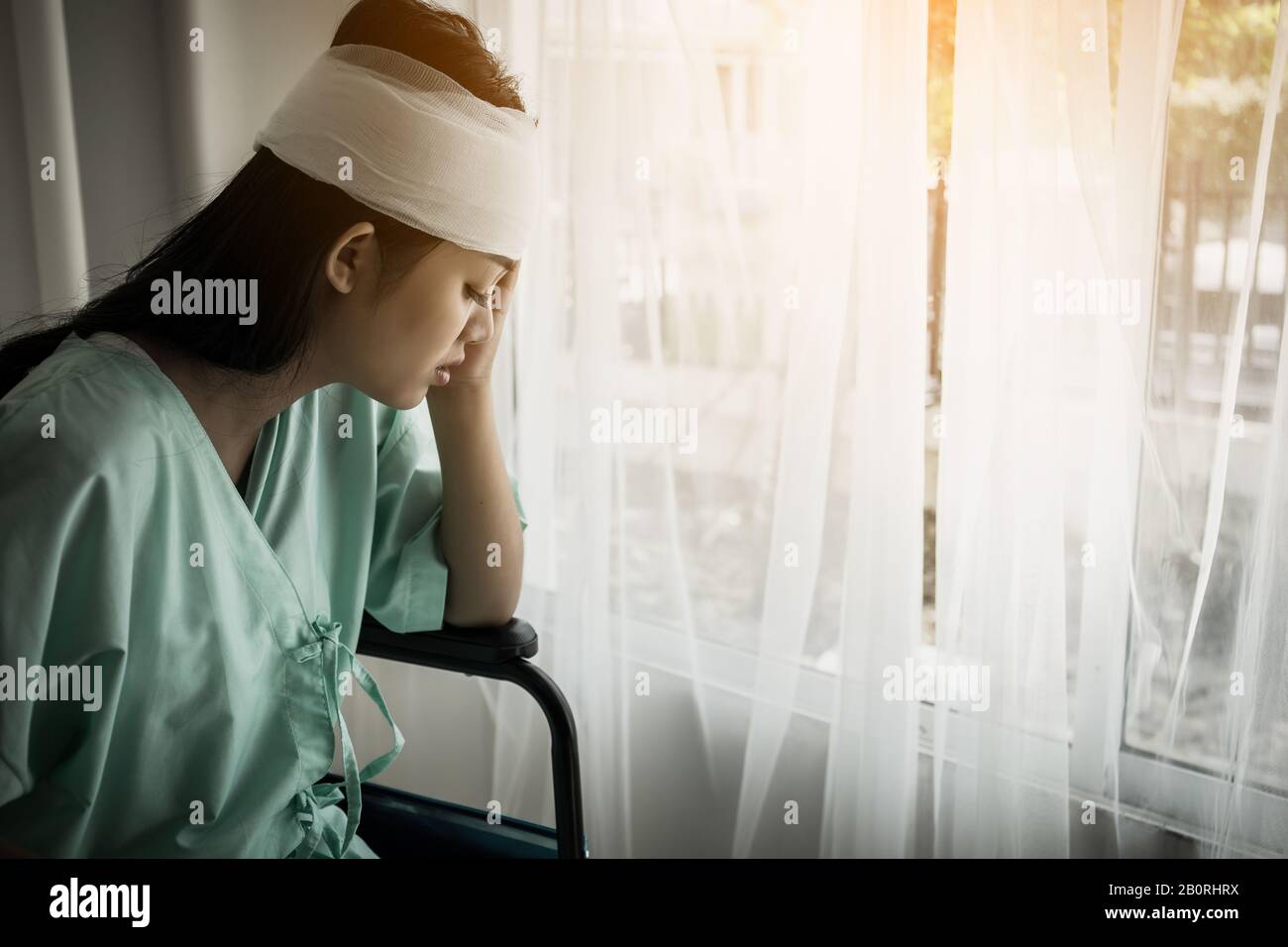 Female patients sitting on wheelchairs have pain after hospitalization