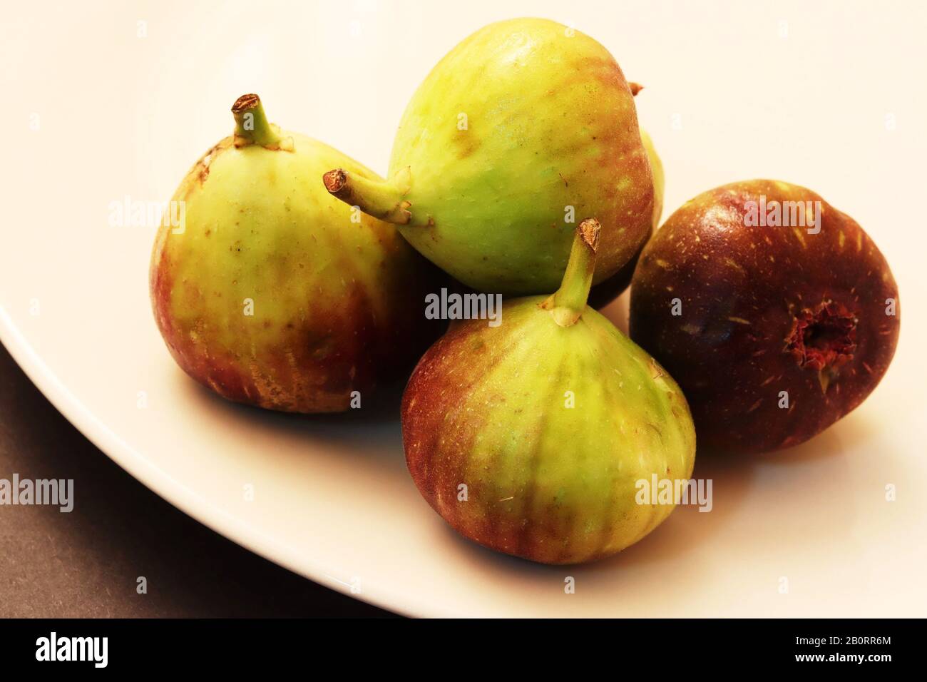 Figs in white plate Stock Photo