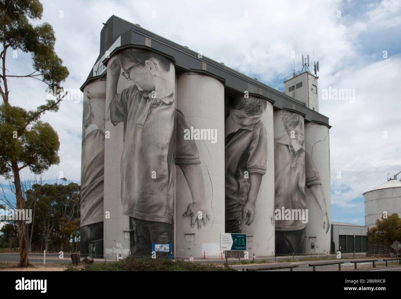 Silo art by Guido van Helten, depicting local schoolchildren, at the tiny South Australian hamlet of Coonalpyn Stock Photo