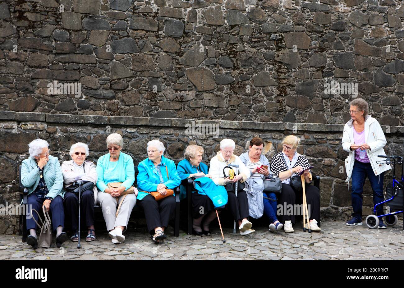 Elderly ladies,OAPs, sitting on a bench inside Stirling Castle, Stirling, Scotland Stock Photo