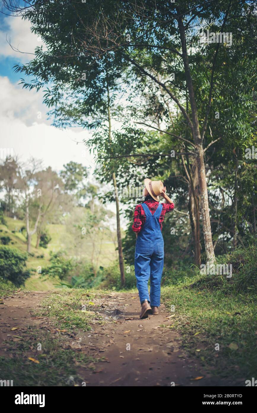 young woman walking in the forest Stock Photo - Alamy