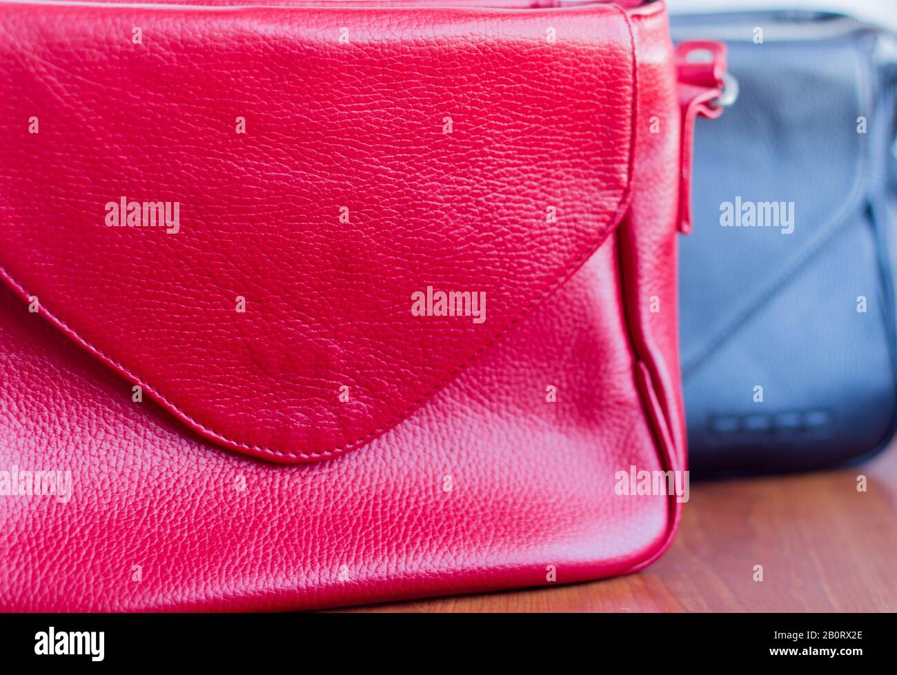 Women's leather bag close-up on the table, selective focus. Stock Photo