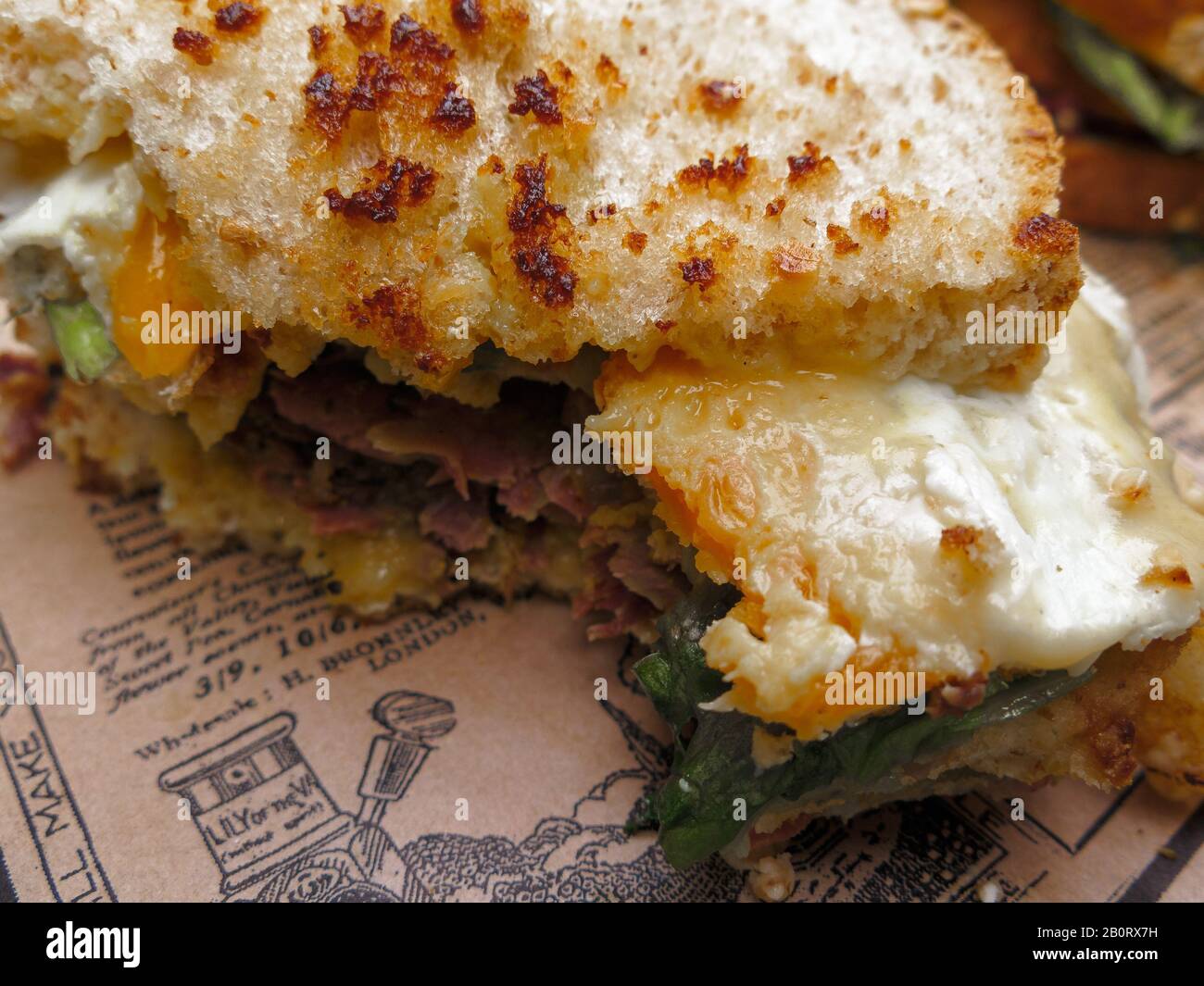 delicious pastrami sandwich over a paper Stock Photo Alamy