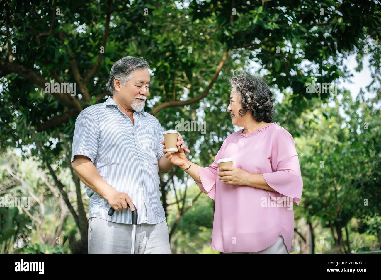 Happy senior couple in the park Stock Photo - Alamy