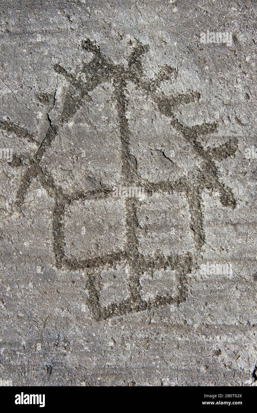 Petroglyph, rock carving, of a house on stilts. Carved by the ancient Camuni people in the iron age between 1000-1200 BC. Rock no 24, Foppi di Nadro, Stock Photo