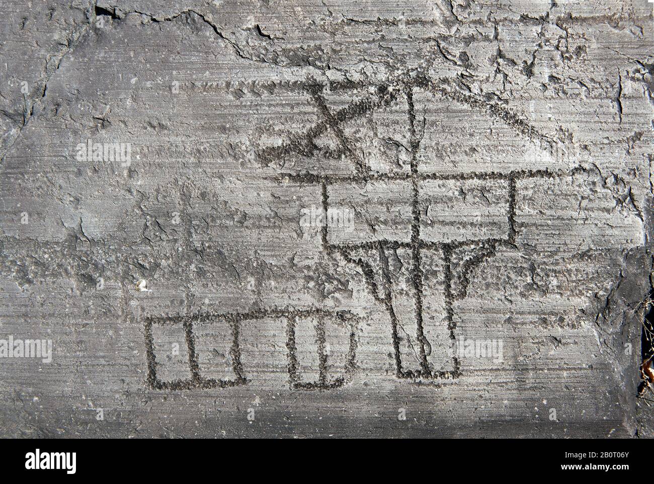 Petroglyph, rock carving, of a house on stilts. Carved by the ancient Camunni people in the iron age between 1000-1200 BC. Rock no 24, Foppi di Nadro, Stock Photo