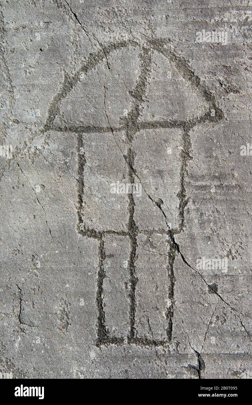 Petroglyph, rock carving, of a house on stilts. Carved by the ancient Camunni people in the iron age between 1000-1200 BC. Rock no 6, Foppi di Nadro, Stock Photo