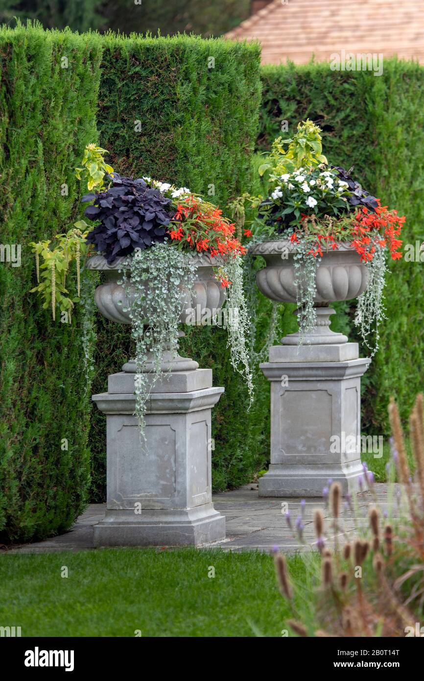 Decorative flower urns in a formal park Stock Photo