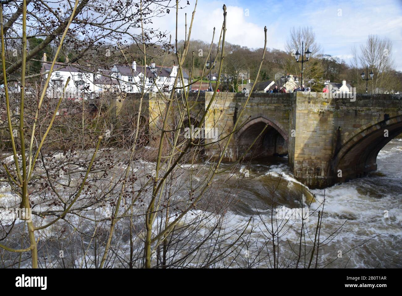 The River Dee at Llangollen, a swollen raging torrent through the town. Stock Photo