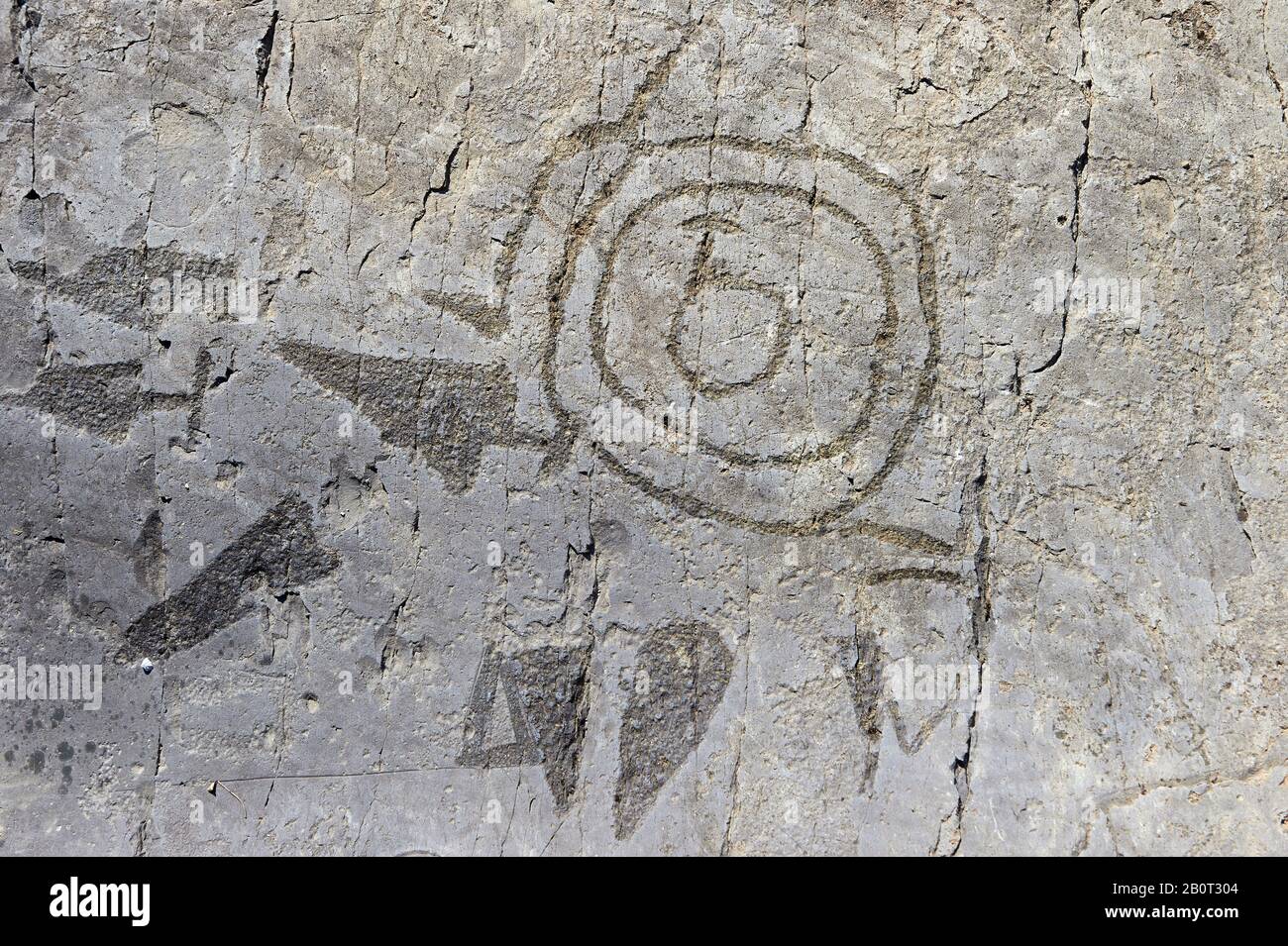 Petroglyph, rock carving, depicting triangular copper daggers with half round pommels used in the copper age , 3300 - 2200 BC and Late Copper Age, 220 Stock Photo