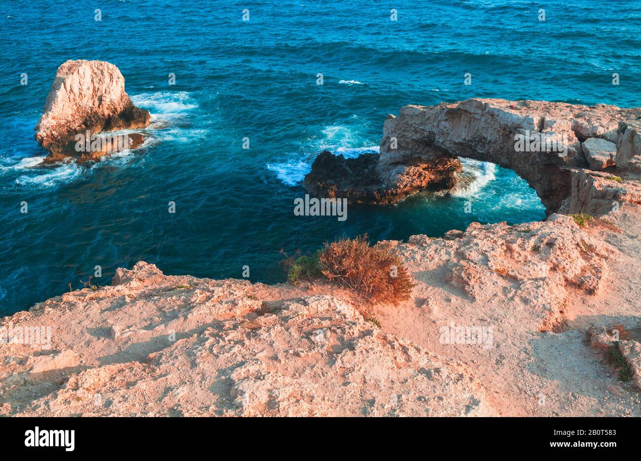 Landscape with natural stone arch known as the Love bridge. Ayia Napa, Cyprus island.  Mediterranean Sea coast Stock Photo