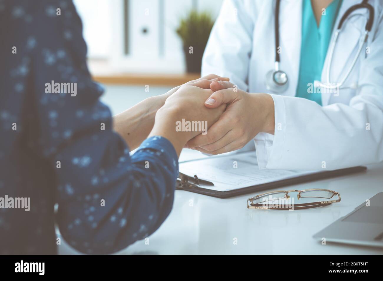 Trusting A Doctor Close-up of doctor reassuring her female patient. Medical ethics and ...