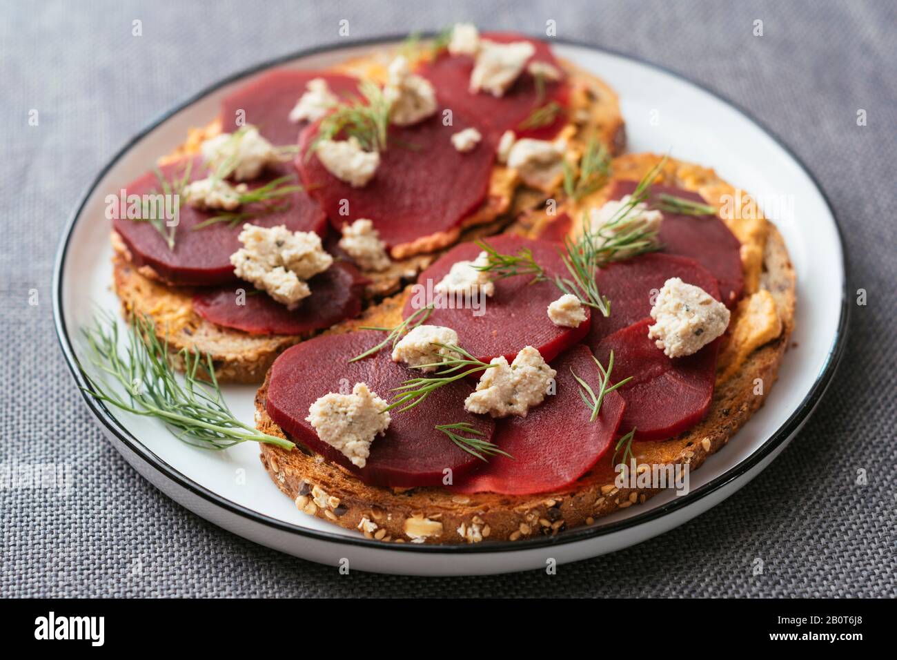 Pickled Beets on Toast with Vegan Feta Stock Photo