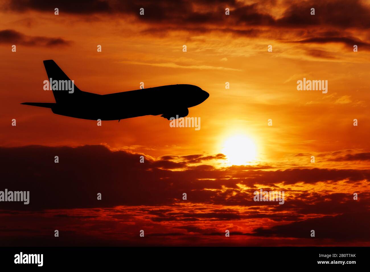 Airplane fly on sunset sky. Airplane in the sky at sunrise Stock Photo ...