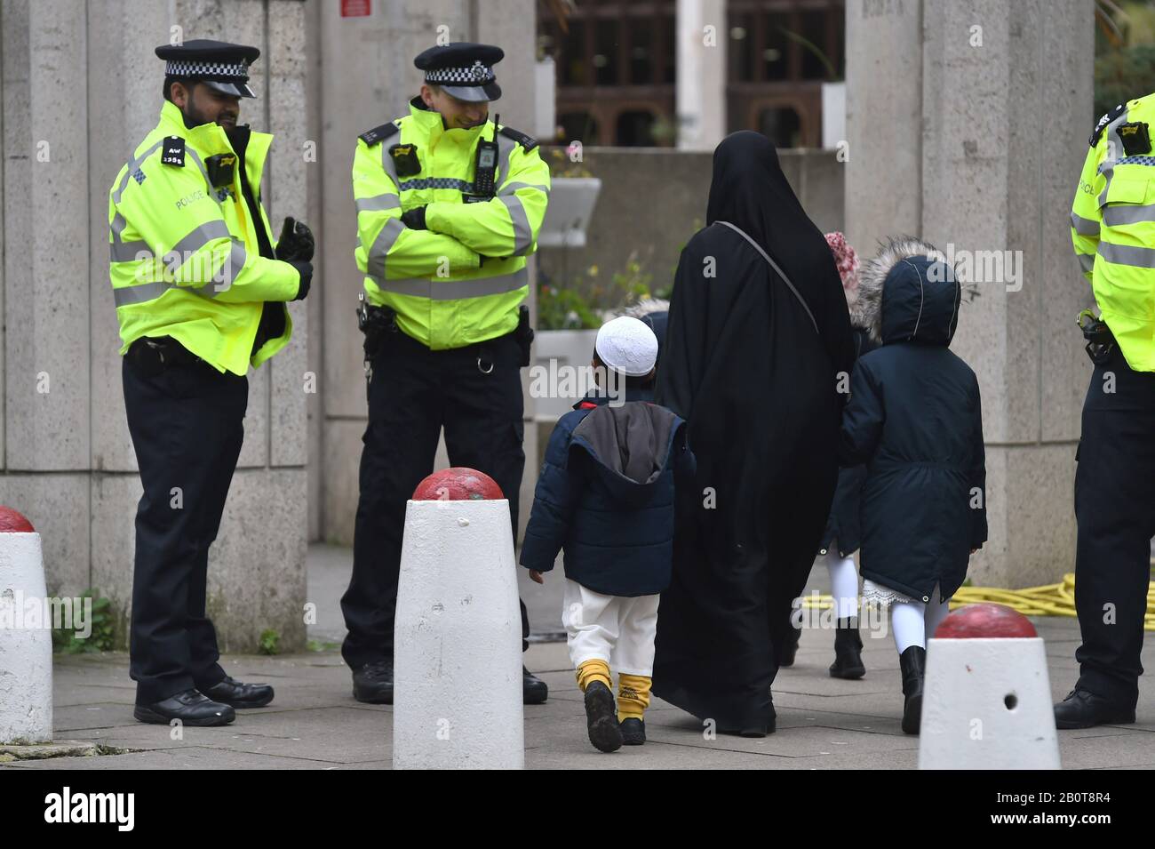 Worshippers arrive for midday prayers at the London Central Mosque, near Regent's Park, north London, where a man was arrested on suspicion of attempted murder on Thursday after police were called to reports of a stabbing. Stock Photo