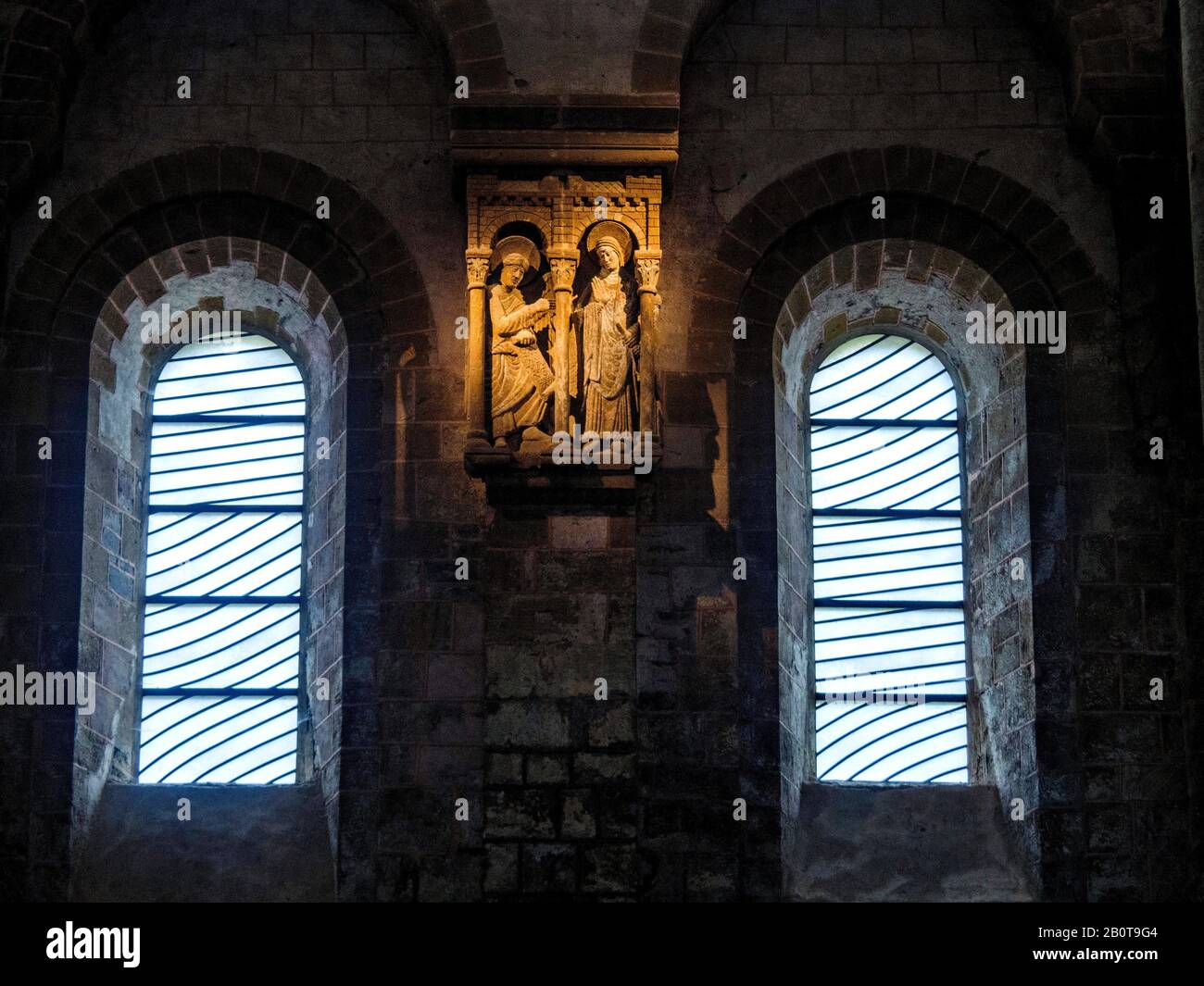 Stained glass window by Pierre Soulages, Sainte Foy abbey church in the ancient village of Conques on Saint James Way,Aveyron, Occitanie, France Stock Photo