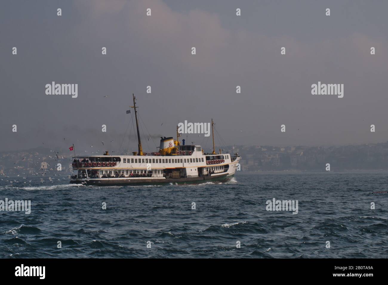 Inner City Cruise Ship Sails on a Hazy Istanbul Day Stock Photo