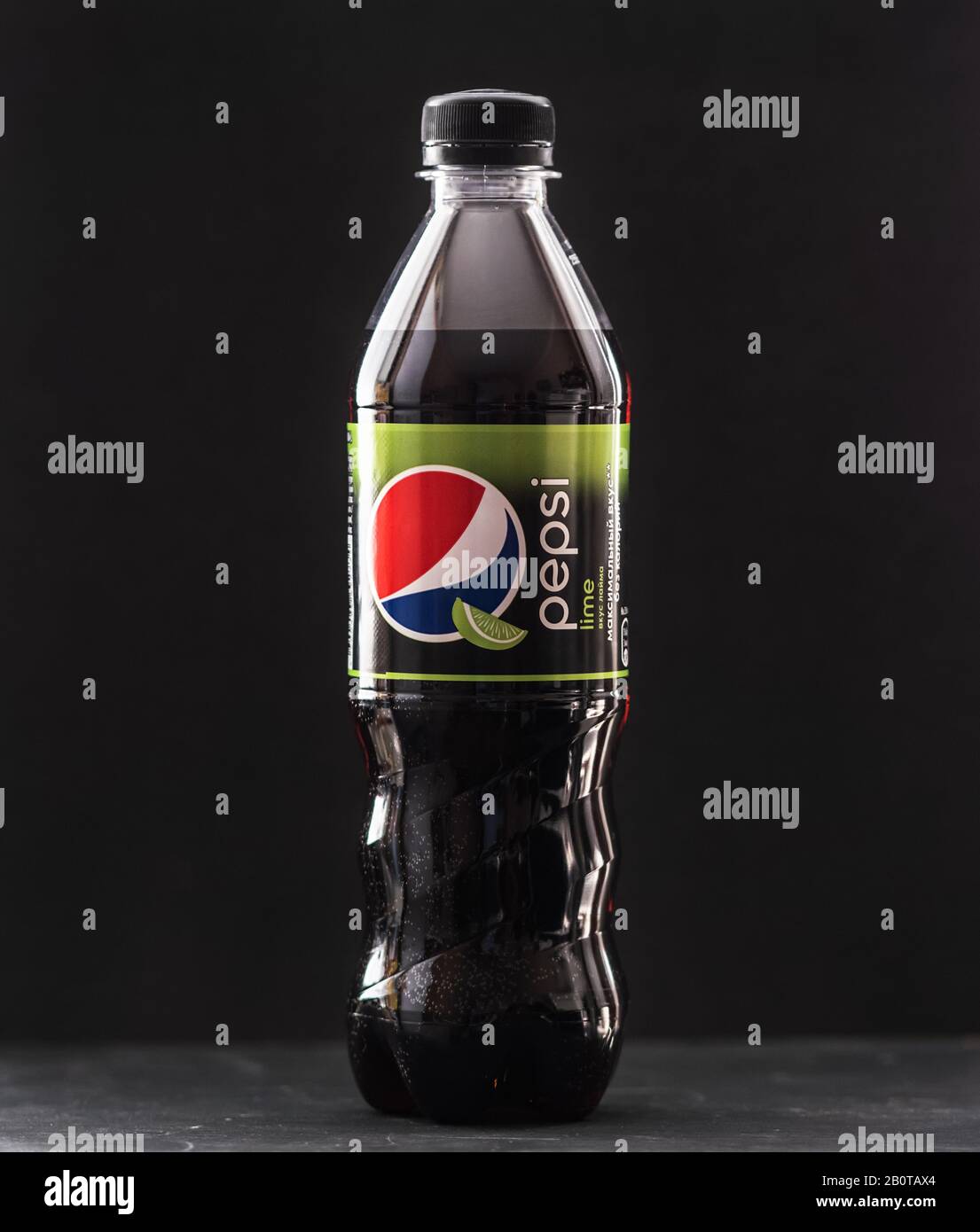 VLADIVOSTOK, RUSSIA - FEBRUARY 14, 2020: Bottle of Pepsi Cola Can on dark background. Pepsi produced by PepsiCo. Stock Photo