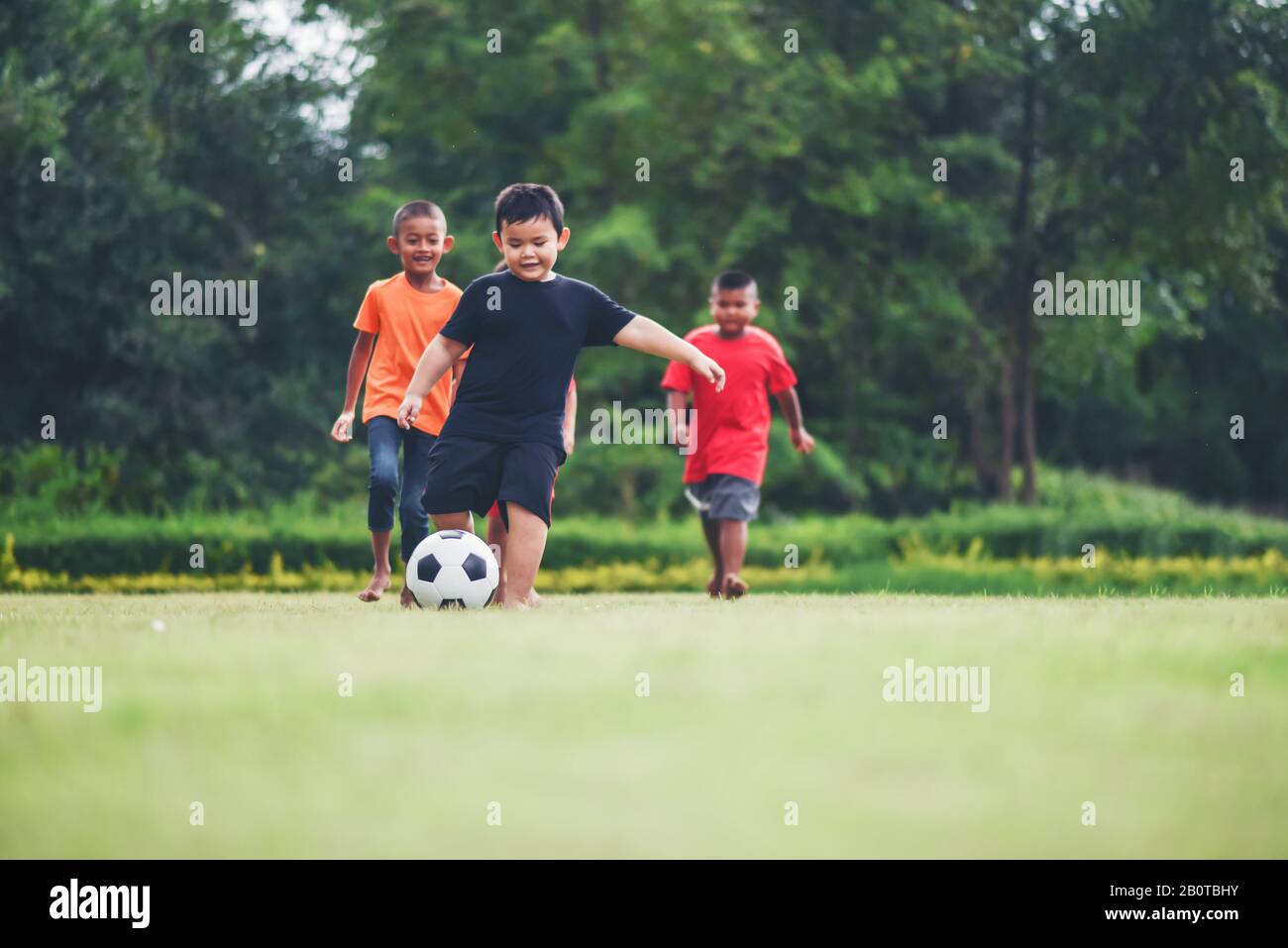 Kids playing soccer football Stock Photo Alamy