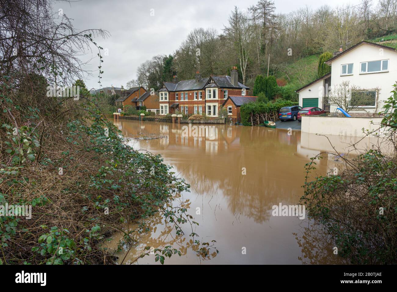 Houses alongside a flooded Wye valley road in Monmouth, South Wales