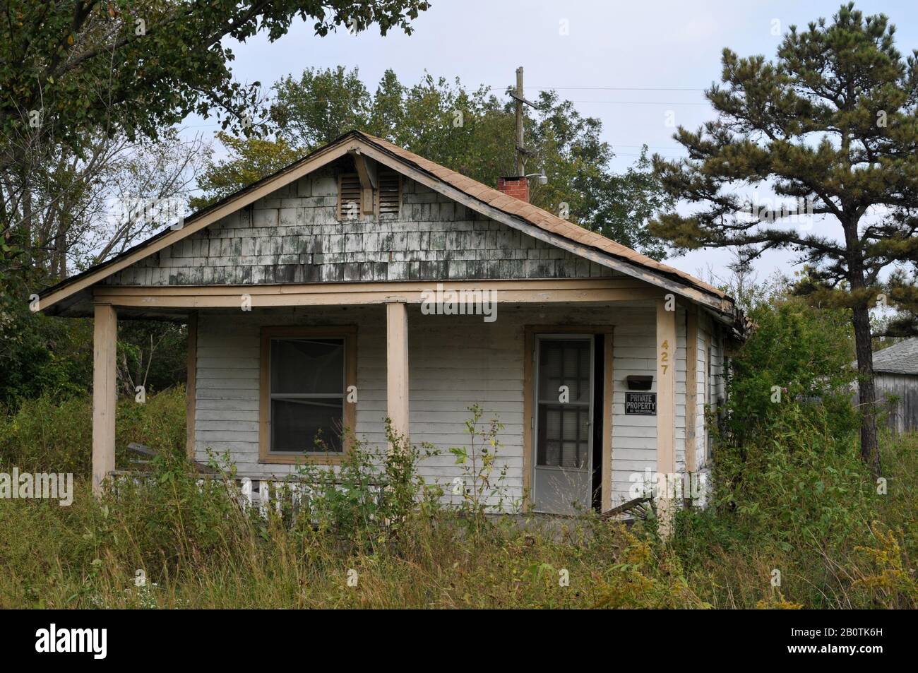 An abandoned home in Picher, OK, a contaminated former mining town that was bought out and evacuated by the Environmental Protection Agency in 2009. Stock Photo