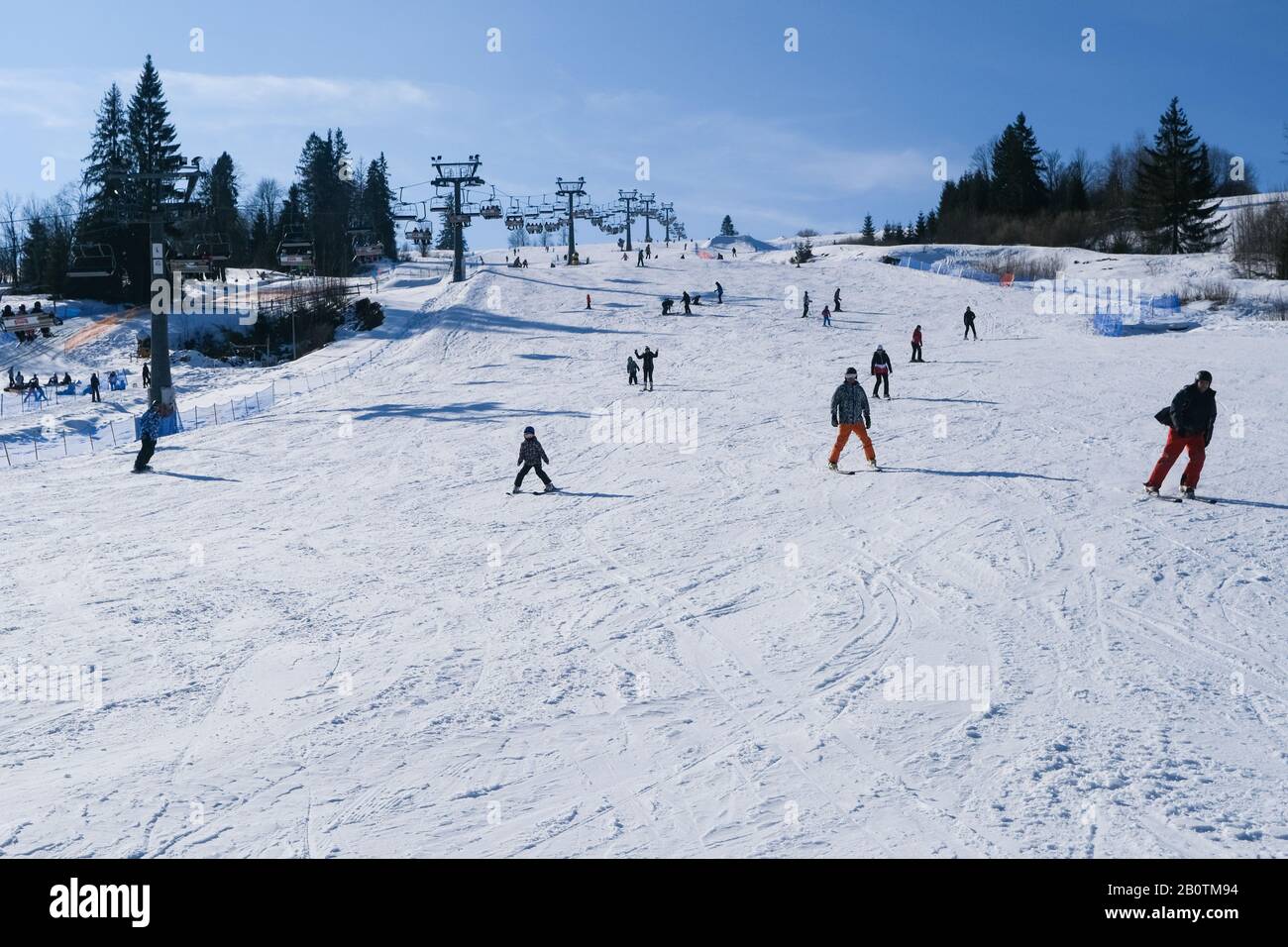 POLAND, ZAKOPANE, WITOW SKI RESORT- 14 February 2020: snowy ski slope full  of skiers and snowboarders Stock Photo - Alamy