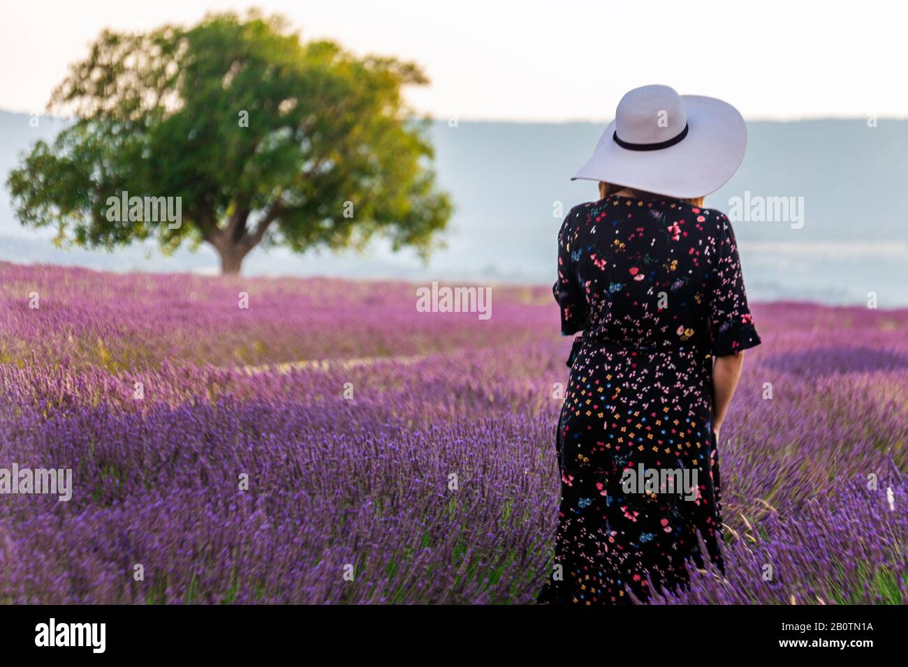 dress with flowers and big white hat 