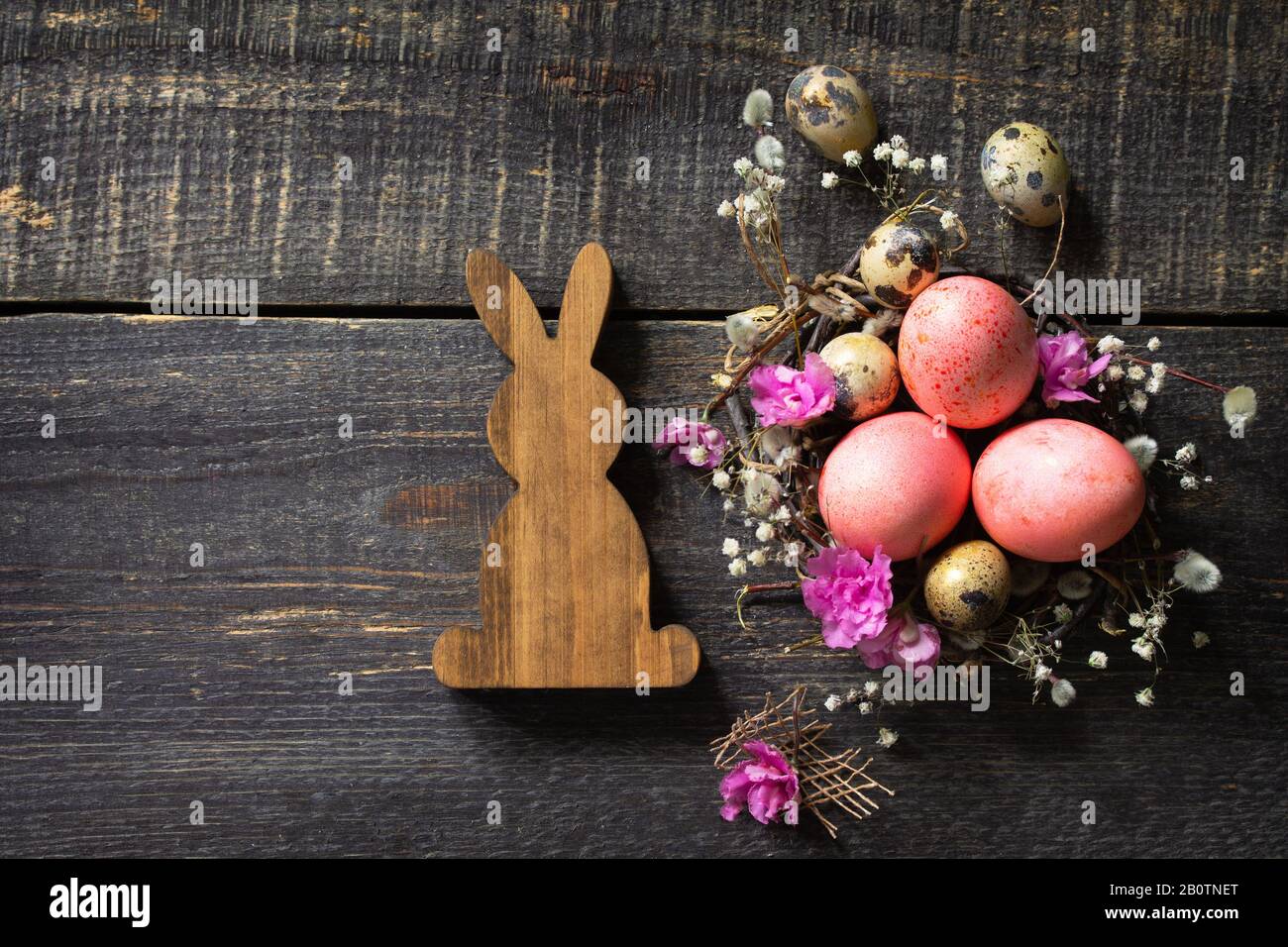 Easter background with Pink handmade Easter eggs and spring flowers ...