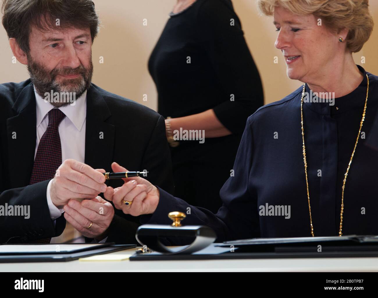 Berlin, Germany. 21st Feb, 2020. Dario Franceschini, the Italian Minister of Culture, hands the pen to Monika Grütters (CDU), Minister of Culture and Media, to sign. It's about a statue of Mary Magdalene. The Nazi art theft was in Italian possession and was returned to Germany today. Credit: Annette Riedl/dpa/Alamy Live News Stock Photo