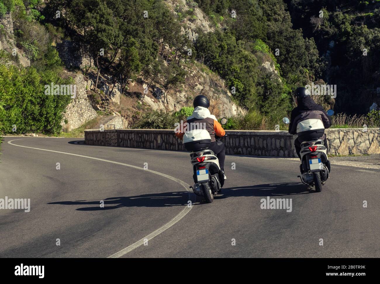 Two scooters riding Amalfi Coast roads, Italy Stock Photo Alamy